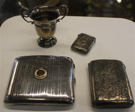 Small silver- 2 cigarette cases, a vesta and a trophy cup